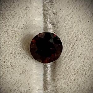 2.1 carat round shaped garnet (January birthstone)
